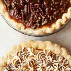 Two whole sweet potato pies with praline and meringue.