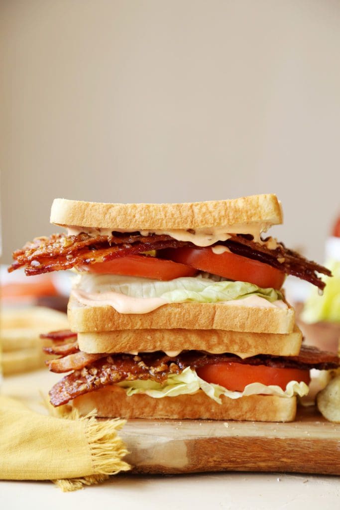 Stack of two praline bacon BLT sandwiches 
