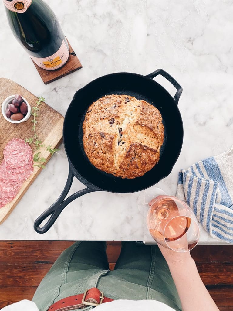 A loaf of baked Irish Soda Bread in a cast iron skillet