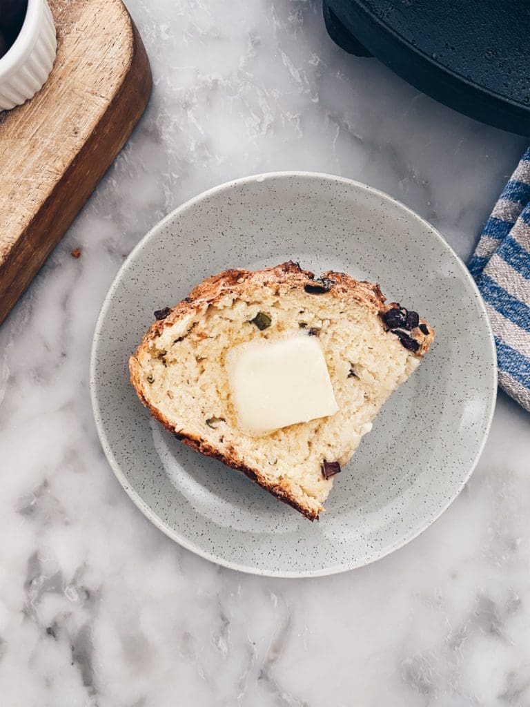 Slice of Irish Soda Bread on a plate with a pat of butter