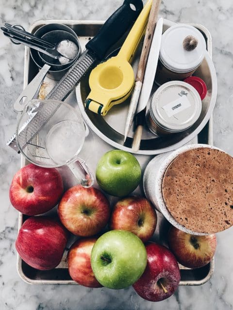 Tray of apple pie ingredients and supplies