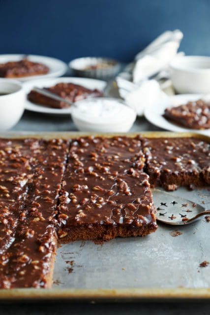 Sliced Texas Sheet Cake in a pan.