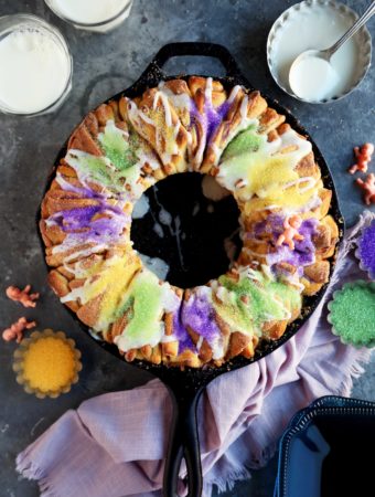 A New Orleans King Cake baked in a cast iron skillet