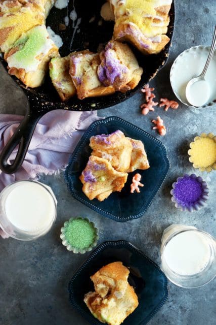 How to make New Orleans King Cake, a pull apart version with slices on a plate