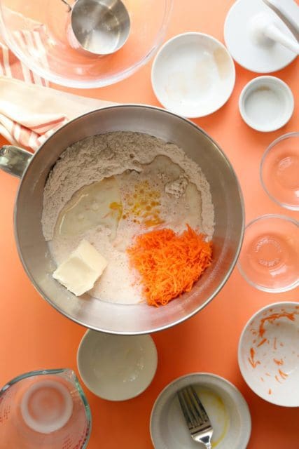 Gluten free carrot cake cinnamon roll ingredients in a bowl.