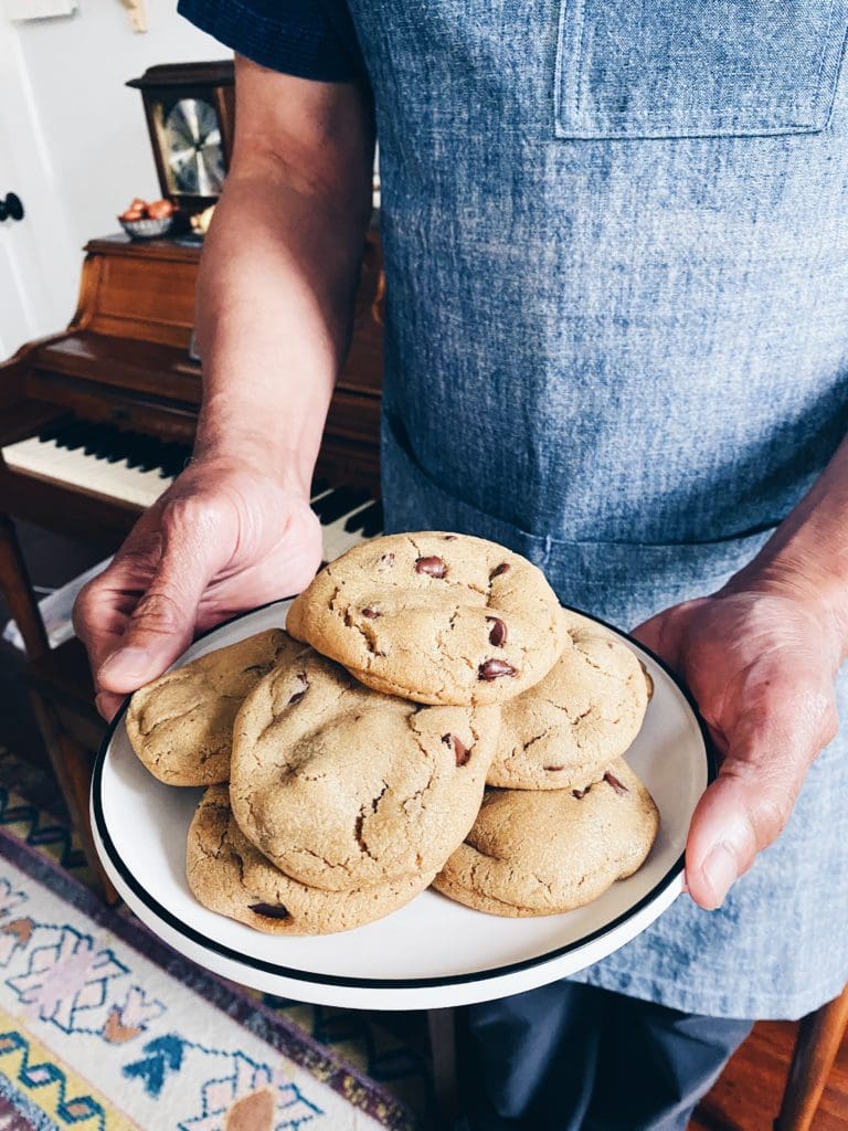 Dad holding a plate of browned butter chocolate chip cookies