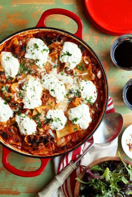 Easy lasagna recipe baked in a skillet topped with ricotta