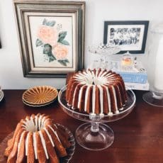 two small bundt cakes, glazed, sitting on counter