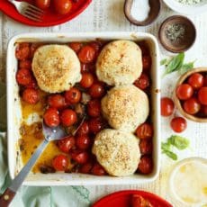 Tomato cobbler baked in a square baking dish.
