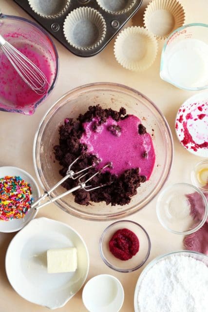Adding wet ingredients to chocolate beet cupcake batter.