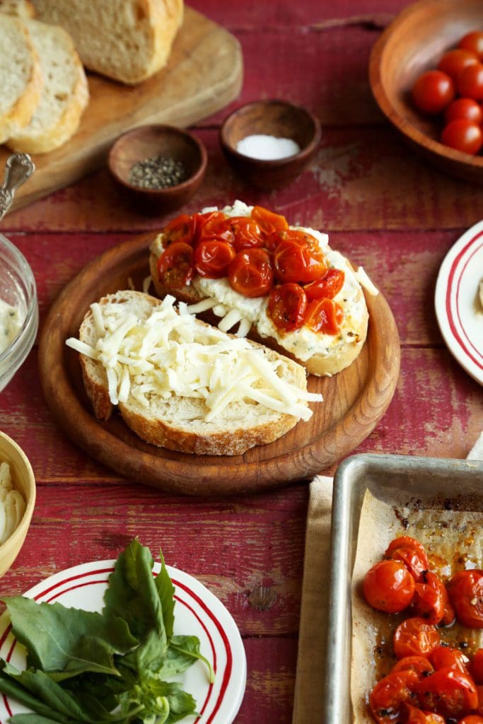 mozzarella and roasted cherry tomatoes on slices of bread