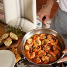 New Orleans Style Shrimp in a buttery sauce in a saucepan.