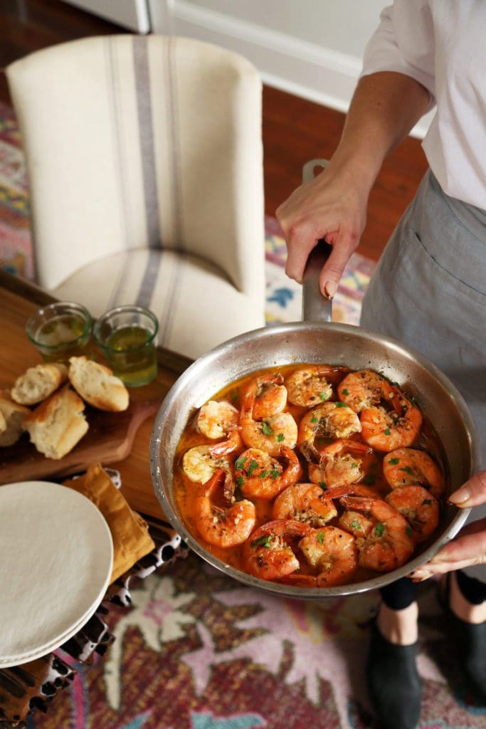 New Orleans Style Shrimp in a buttery sauce in a saucepan.