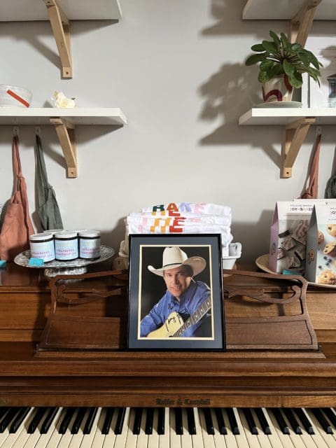 autographed picture of George Strait on piano.