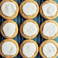 Glazed cookies in rows on a wire rack.