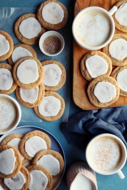 Taylor Swift cookie recipe scattered on a board with tea.