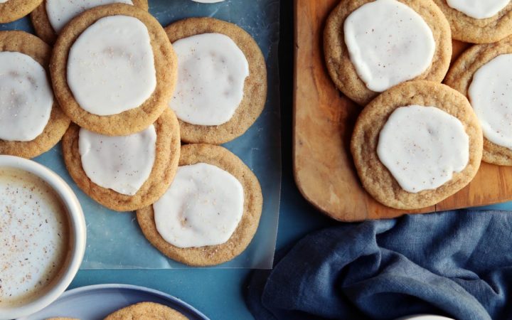 Taylor Swift cookie recipe scattered on a board with tea.