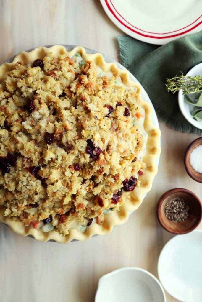Turkey pot pie topped with cranberry stuffing before baked
