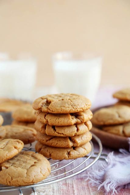 Stacked peanut butter cookie recipe on a wire rack.