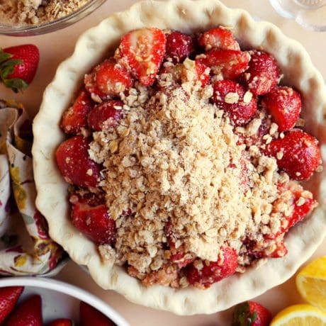 Strawberry pie filling inside of unbaked crust with crumble top.