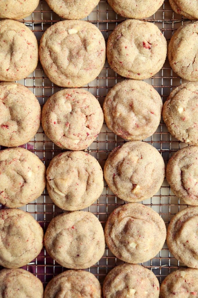 Baked Taylor Swift sugar cookies on cooling rack.