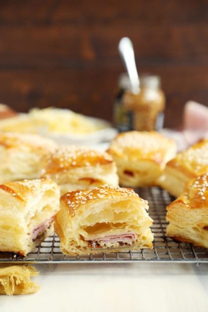 Ham and cheese croissants sliced in half to reveal ham.