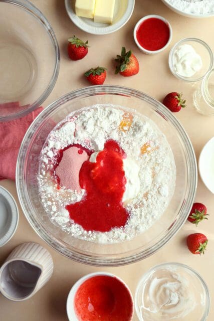 cake mix, jello and strawberry puree in large bowl for cake batter.