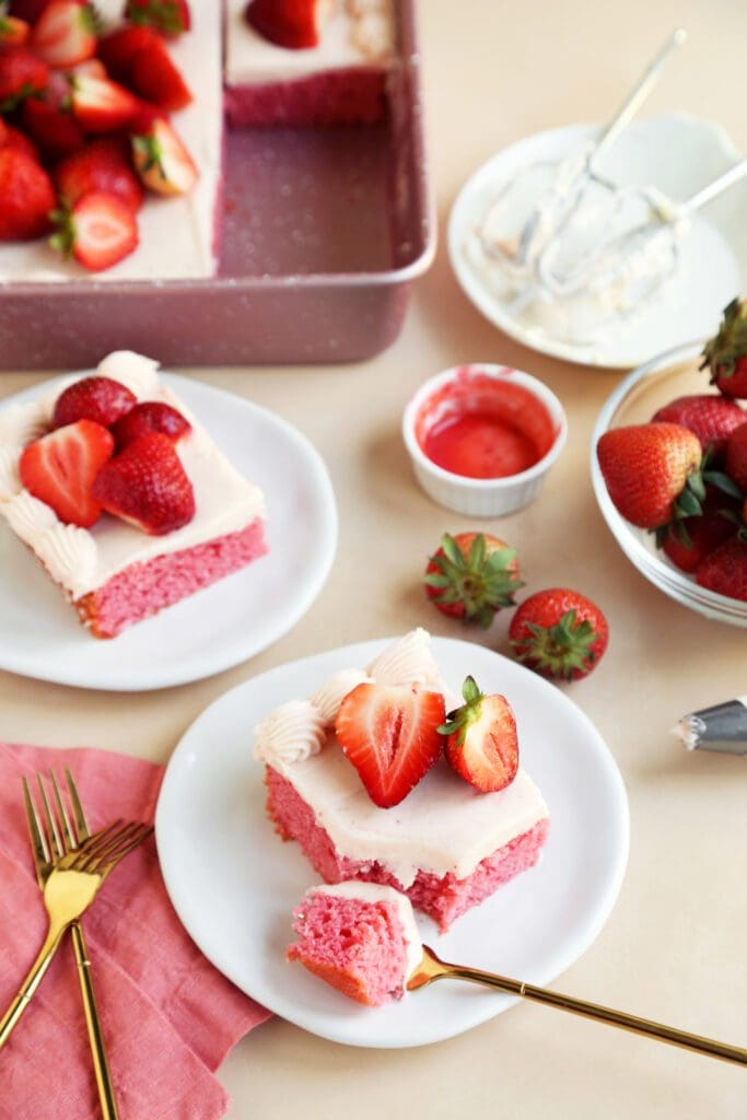 Eating strawberry sheet cake with a fork.