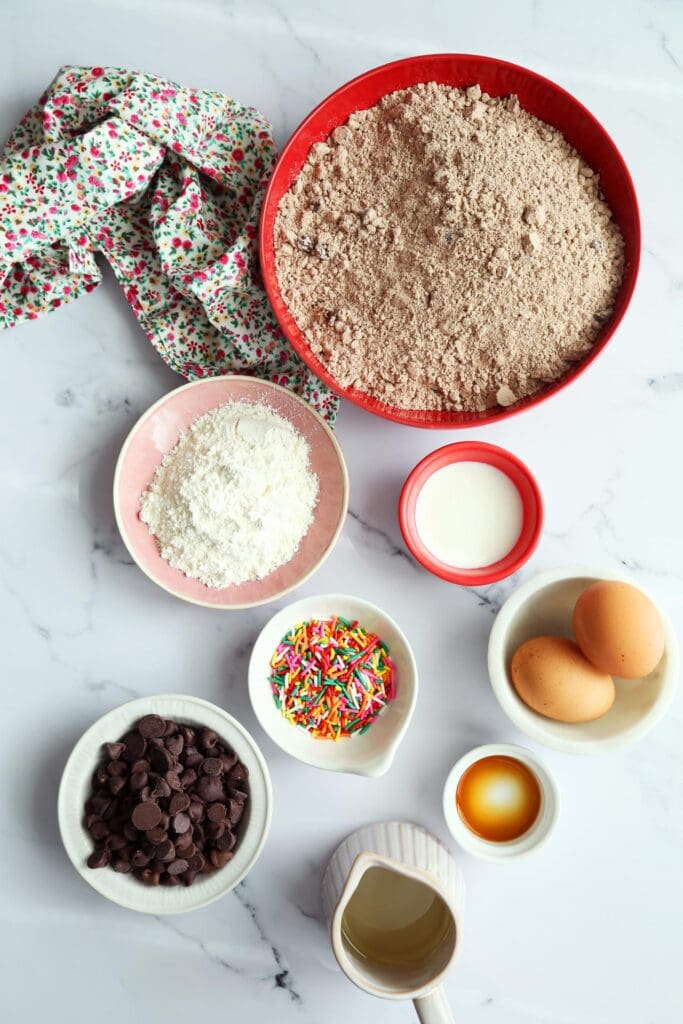 Ingredients for brownie cookies in small bowls for baking.