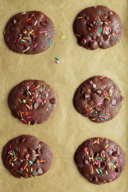 Baked chocolate cookies on baking sheet.