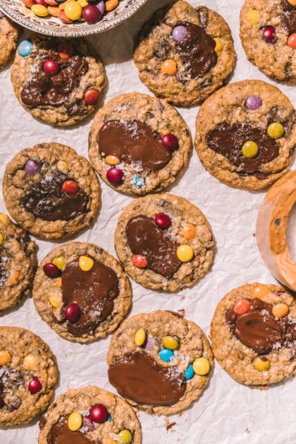 Baked Taylor Swift cookies on parchment paper.