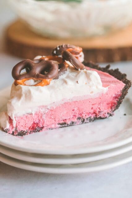 Slice of fluffy, creamy cranberry pie on a small plate.