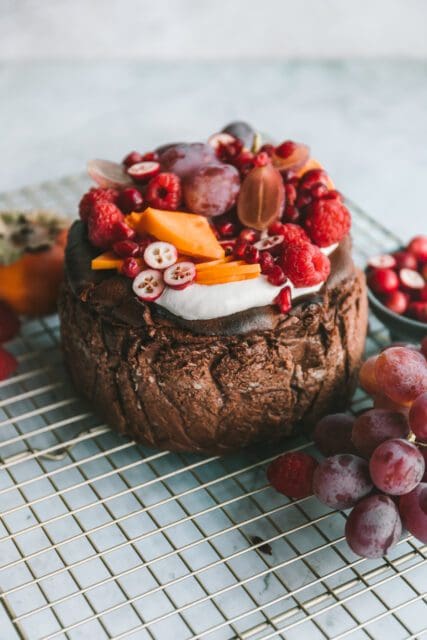 Chocolate basque cheesecake topped with fruit.