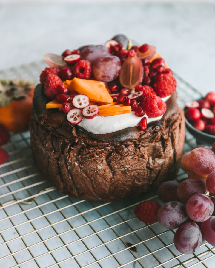 Chocolate basque cheesecake topped with fruit.