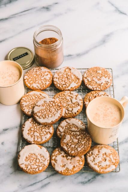 Iced Oatmeal Cookies layered on a cooling rack.