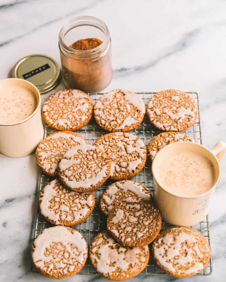 Iced Oatmeal Cookies layered on a cooling rack.