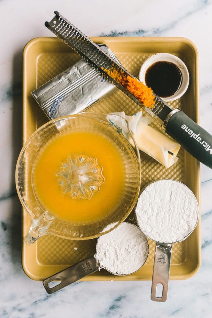 Ingredients for orange cream cheese glaze.
