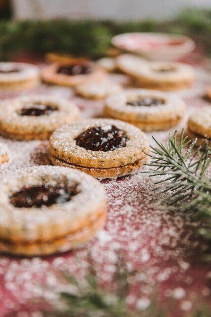 Dusted linzer cookies dusted with powdered sugar.