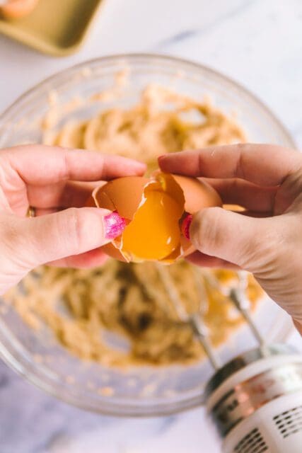 separating an egg yolk for cookie dough