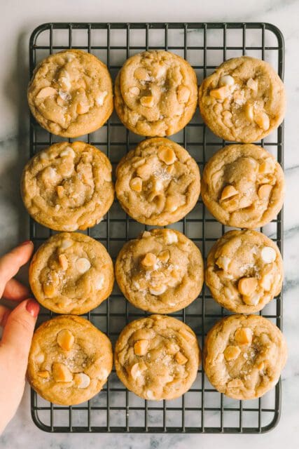 white chocolate macadamia nut cookies on a cooling rack