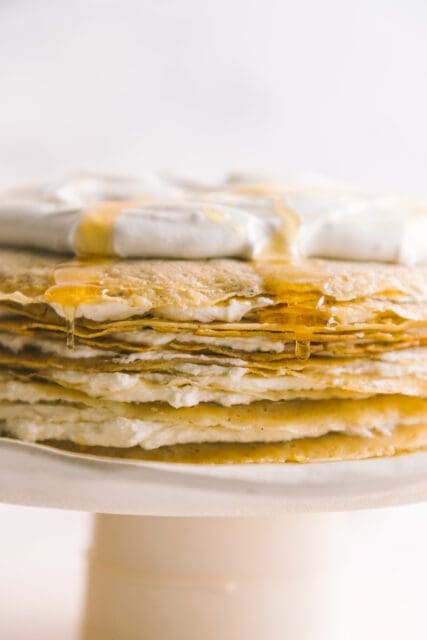 close up view of layers of crepes with cream on top