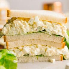 egg salad recipe on a sandwich cut in half