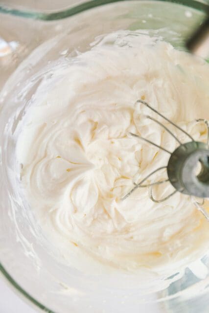 mixing frosting in a stand mixer fitted with the whisk attachment