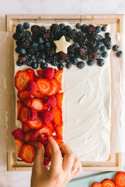 building the Texas flag out of fruit for a 4th of July cake