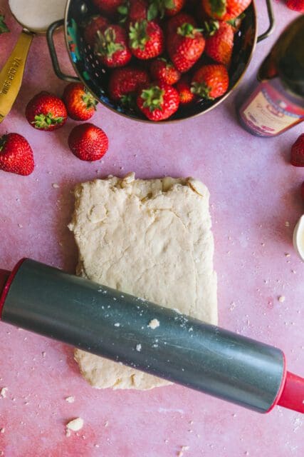 rolling out dough for strawberry shortcake recipe