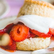 close up of strawberry shortcake recipe with soft whipped cream