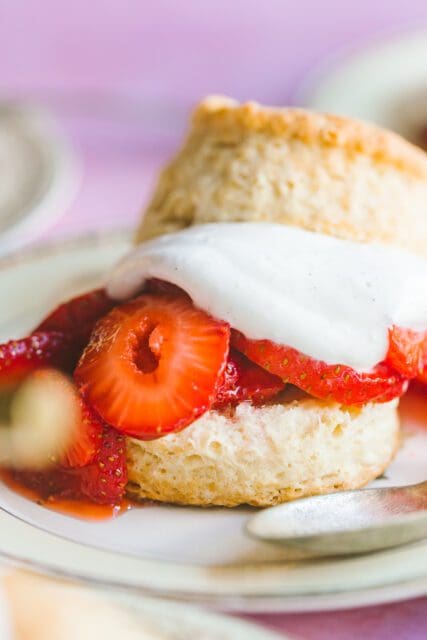 close up of strawberry shortcake recipe with soft whipped cream