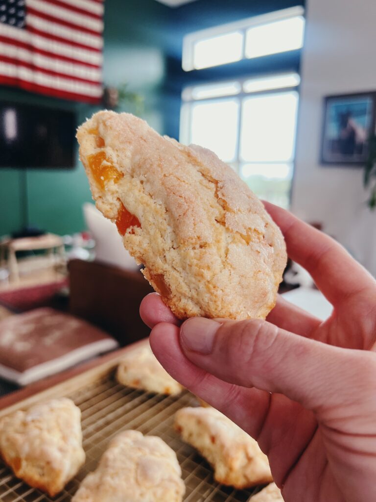 close up of freshly baked apricot ginger scones, with fruit showing through the fluffy dough